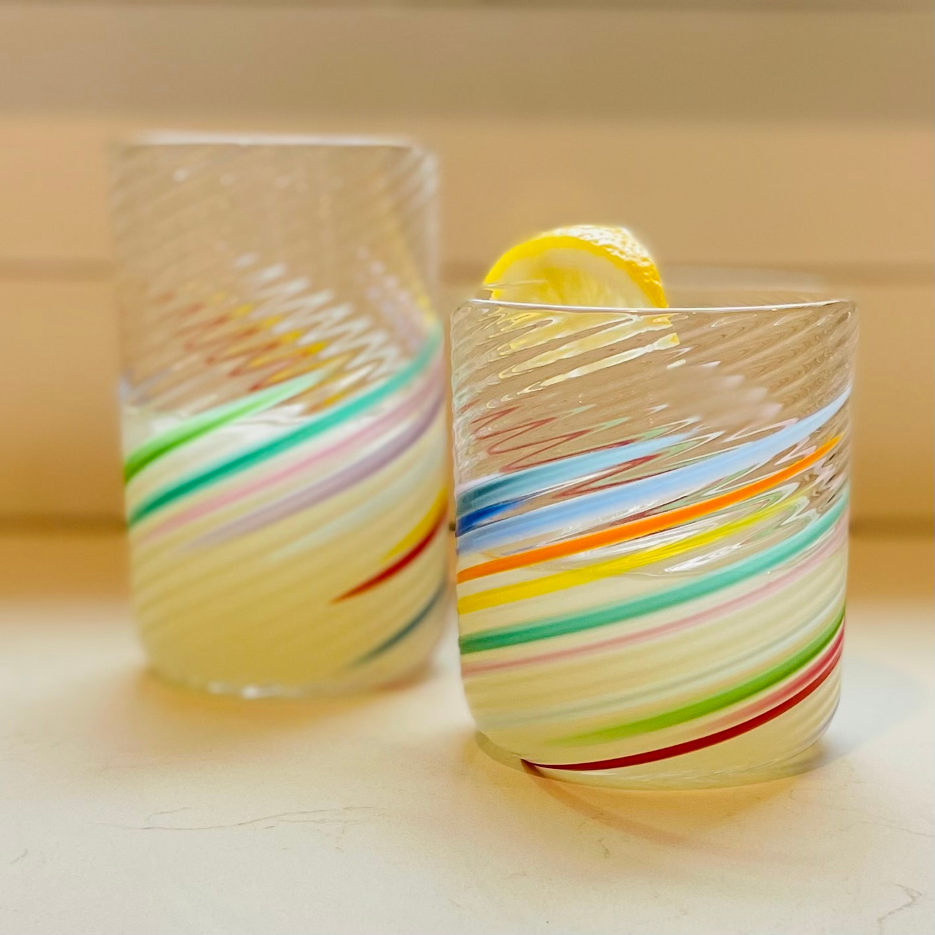 handcrafted big glass tumbler and rocks tumbler with a refreshing beverage