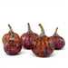 Five decorative glass pumpkins with textured orange and purple marbled patterns and realistic stems, arranged on a clean white background.