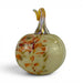 A decorative hand-blown glass pumpkin with a pale yellow-green base, orange and brown floral patterns, and a curved iridescent stem, shown on a white background.
