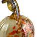 A decorative hand-blown glass pumpkin with a textured cream body, orange and red speckles, and a curved amber-yellow stem, shown against a plain white background.