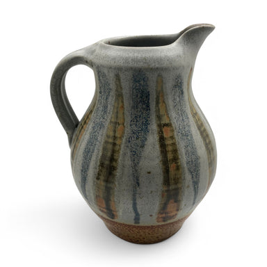 stoneware pouring pitcher with blue and green stripes