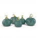 Five decorative glass pumpkins in a mottled teal green color with clear glass stems, arranged on a white background.