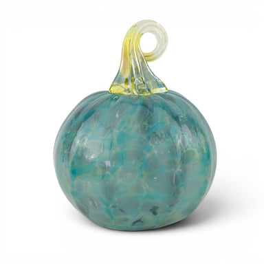 A decorative glass pumpkin ornament with a marbled teal and light blue body, a translucent yellow-green stem, and a looped top, shown on a plain white background.