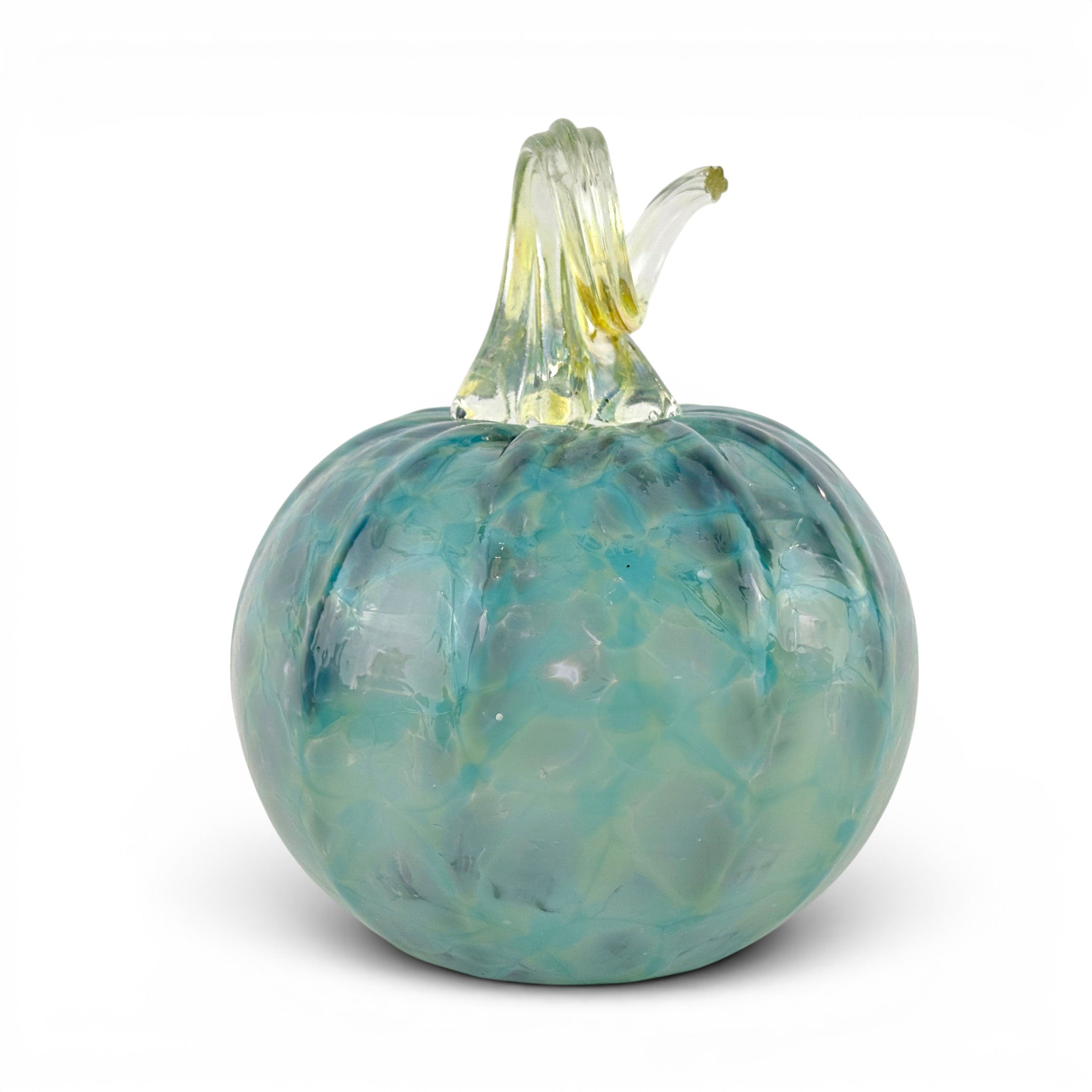 A decorative glass pumpkin with a textured, marbled teal and light blue body and a ribbed clear glass stem with a yellow-green tip, set against a plain white background.