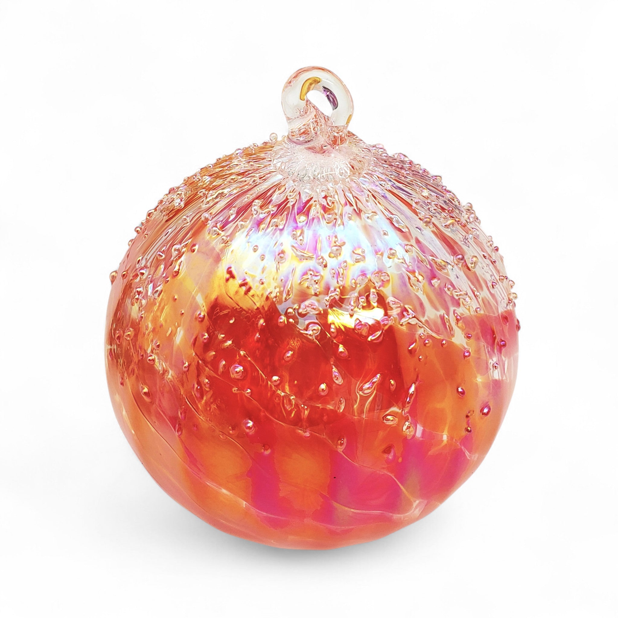 Glass ornament with red and pink colors on a white background