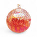 Glass ornament with red and pink colors on a white background