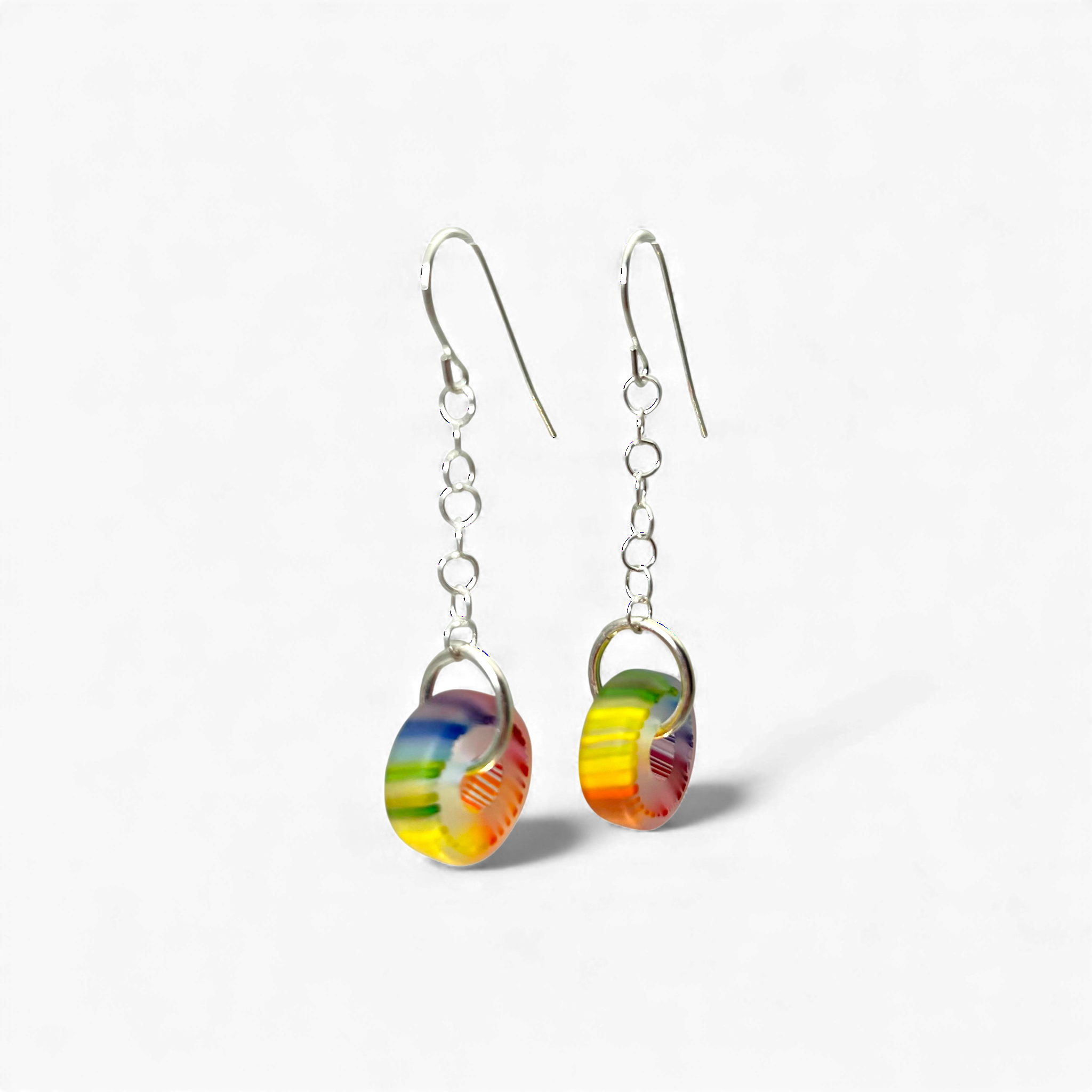 Pair of colorful earrings on a white background