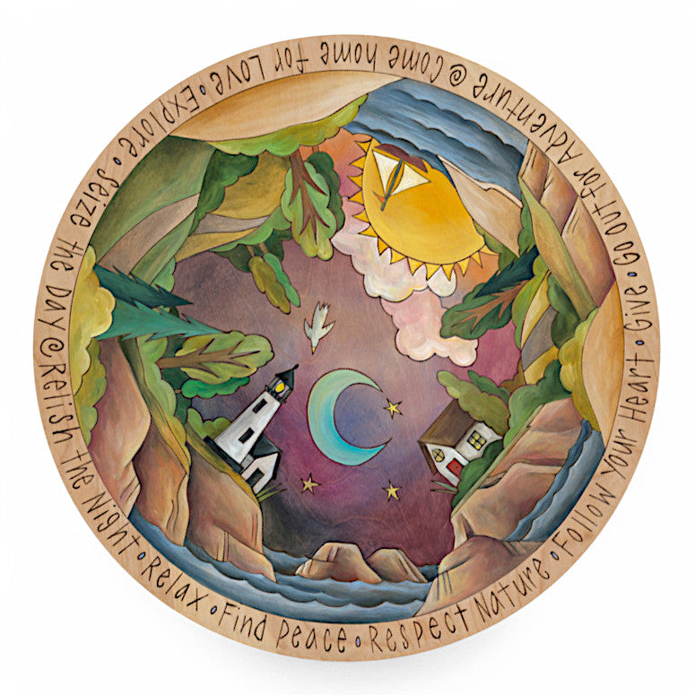 lazy susan with lighthouse, cottage, sun, moon, and beautiful ocean view