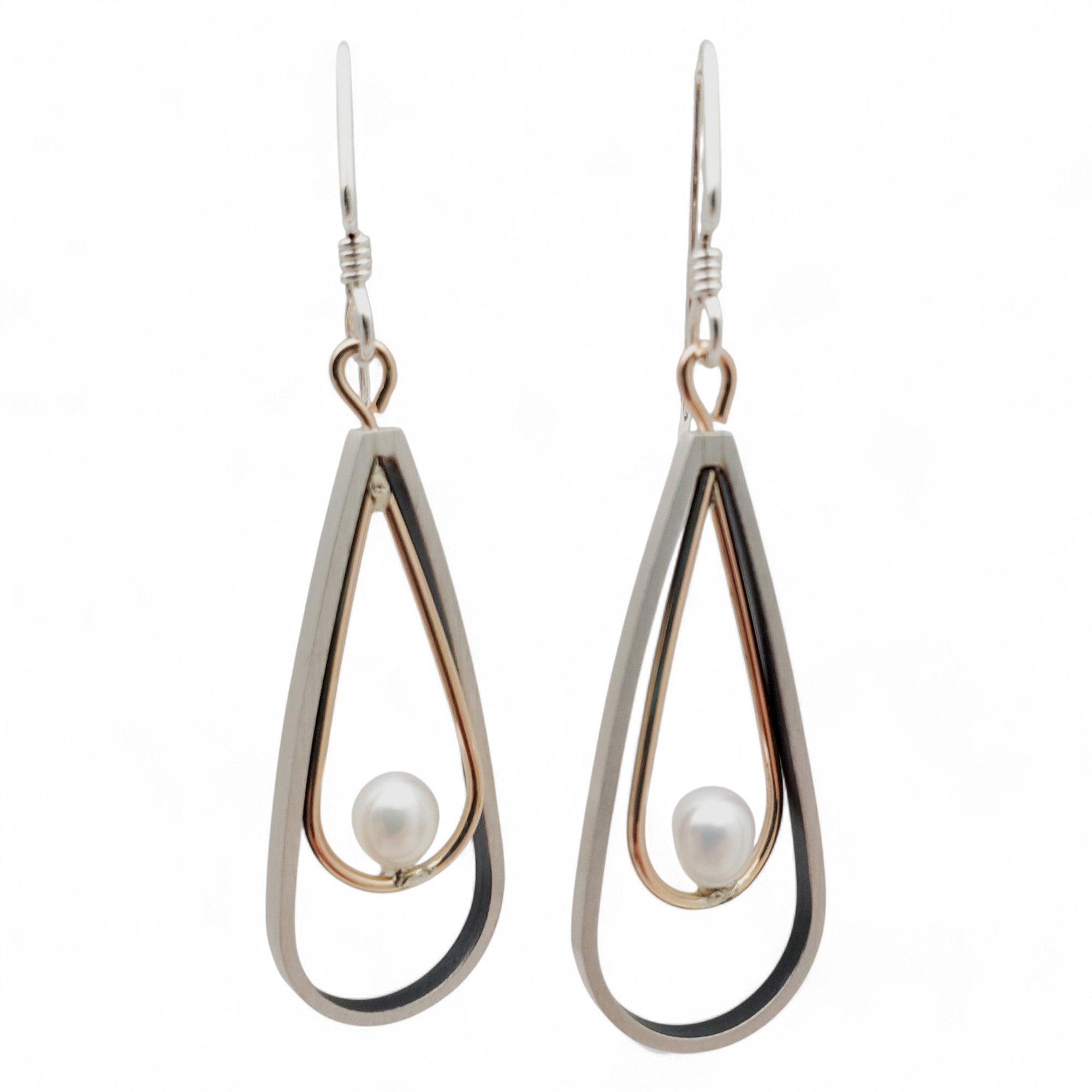 brushed sterling silver and gold-fill earrings with a pearl in a teardrop design