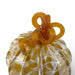 A decorative glass pumpkin with a textured, marbled golden-yellow body and a twisted, looped stem in a translucent amber-orange glass.