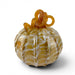 A decorative glass pumpkin with a ribbed body, featuring marbled amber-yellow and white patterns, topped with a twisted stem.