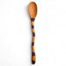 wooden spoon with black band on a white background
