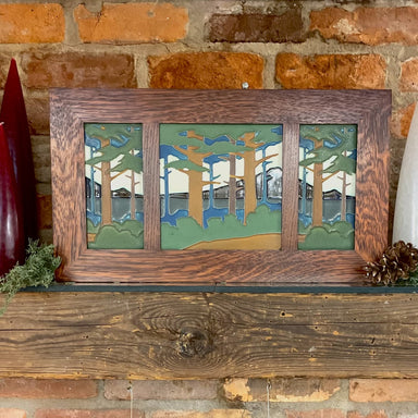 Three handcrafted ceramic tiles set in a handcrafted oak frame