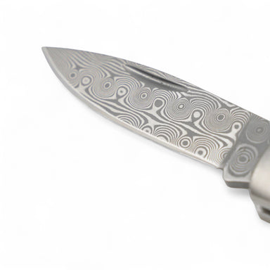close-up of Damascus steel blade with small rose pattern