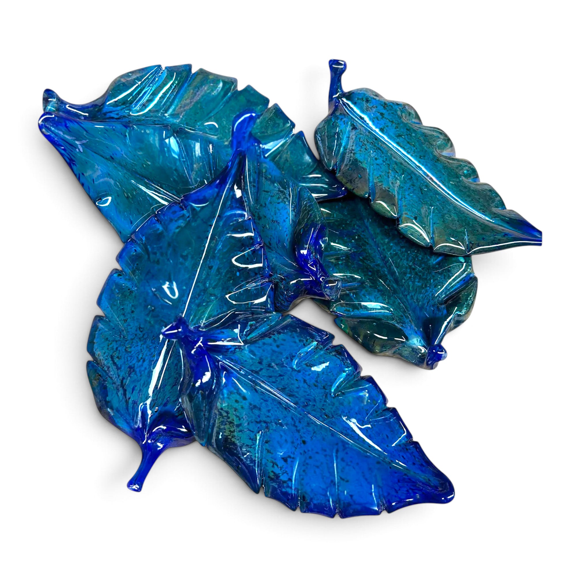A set of five glossy, hand-blown glass leaves in shades of vibrant blue and deep teal. 