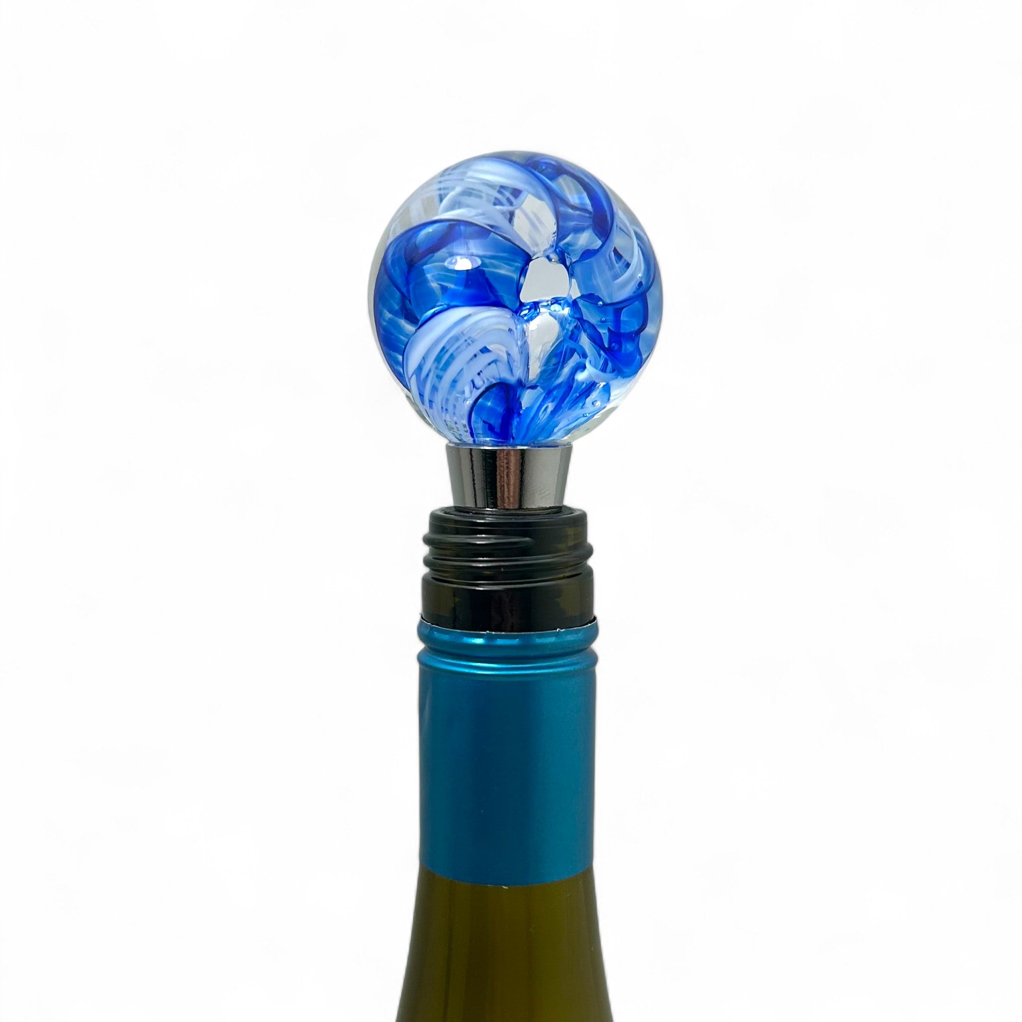 Blue and white marbled wine bottle stopper on a white background