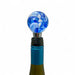 Blue and white marbled wine bottle stopper on a white background