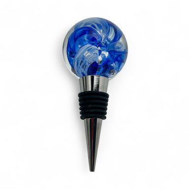Blue and clear glass bottle stopper with metallic top on a white background