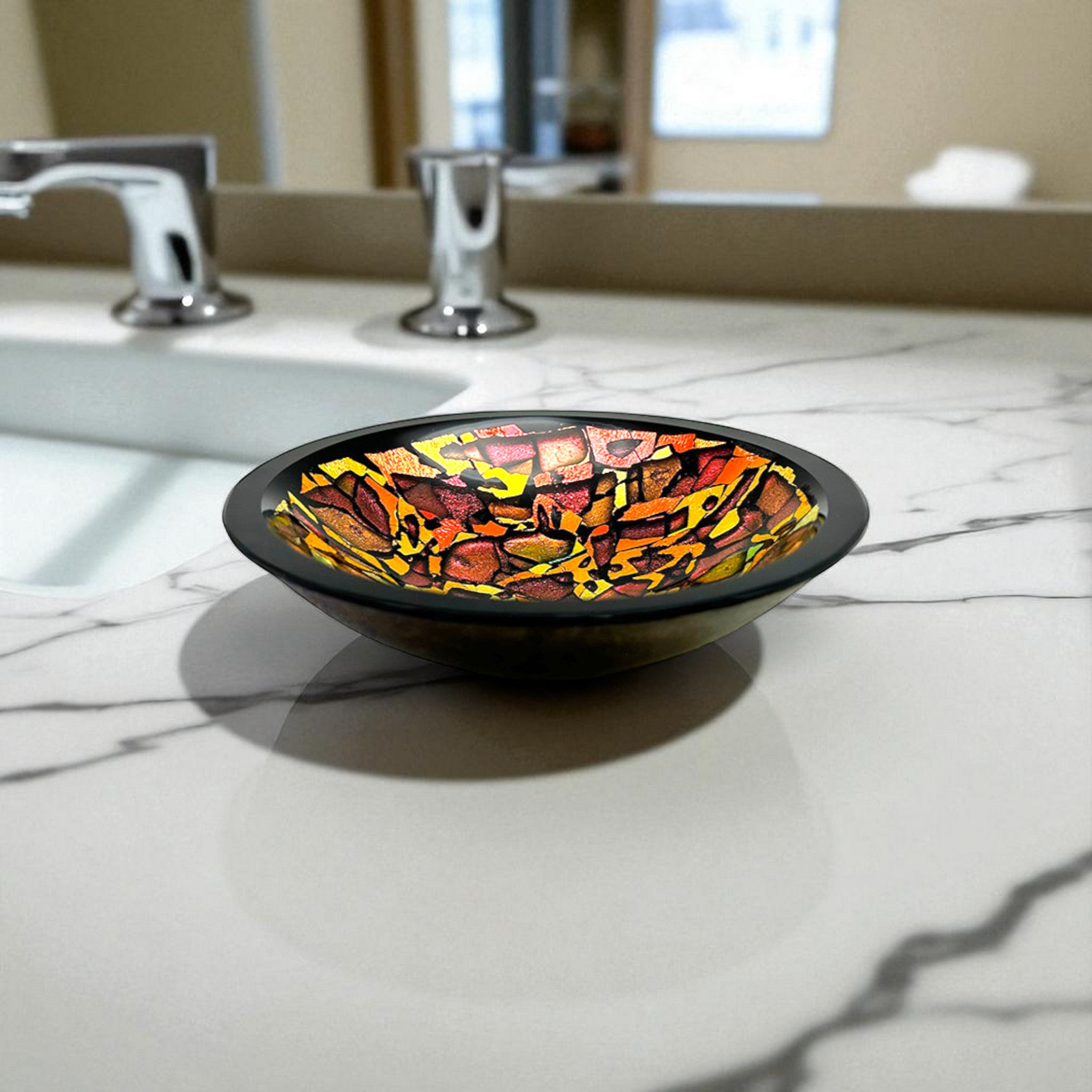 Colorful glass bowl on a marble countertop with bathroom fixtures in the background