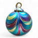 Multicolored glass ornament with a swirl pattern on a white background