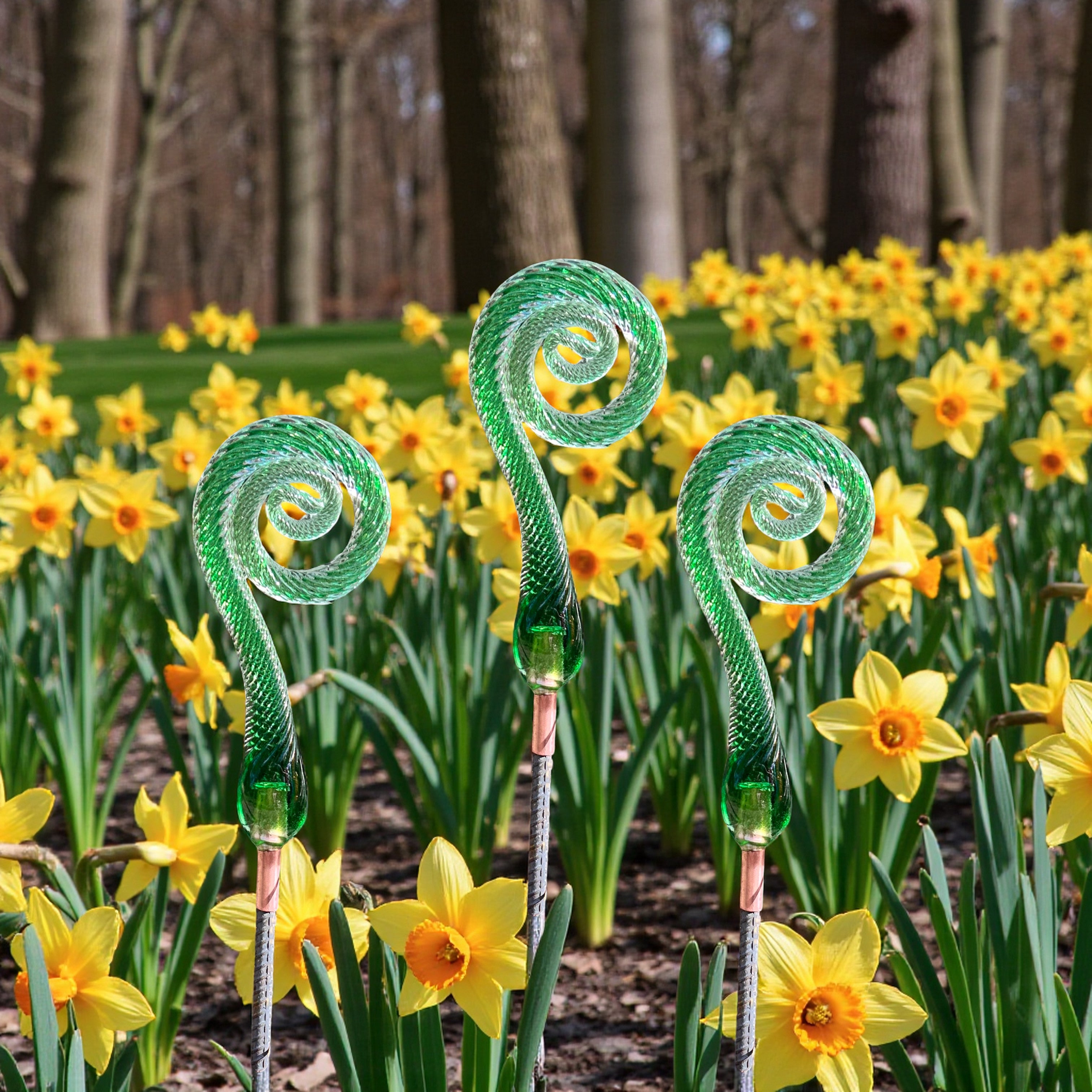 Decorate your spring garden with handcrafted dark green glass fiddlehead ferns