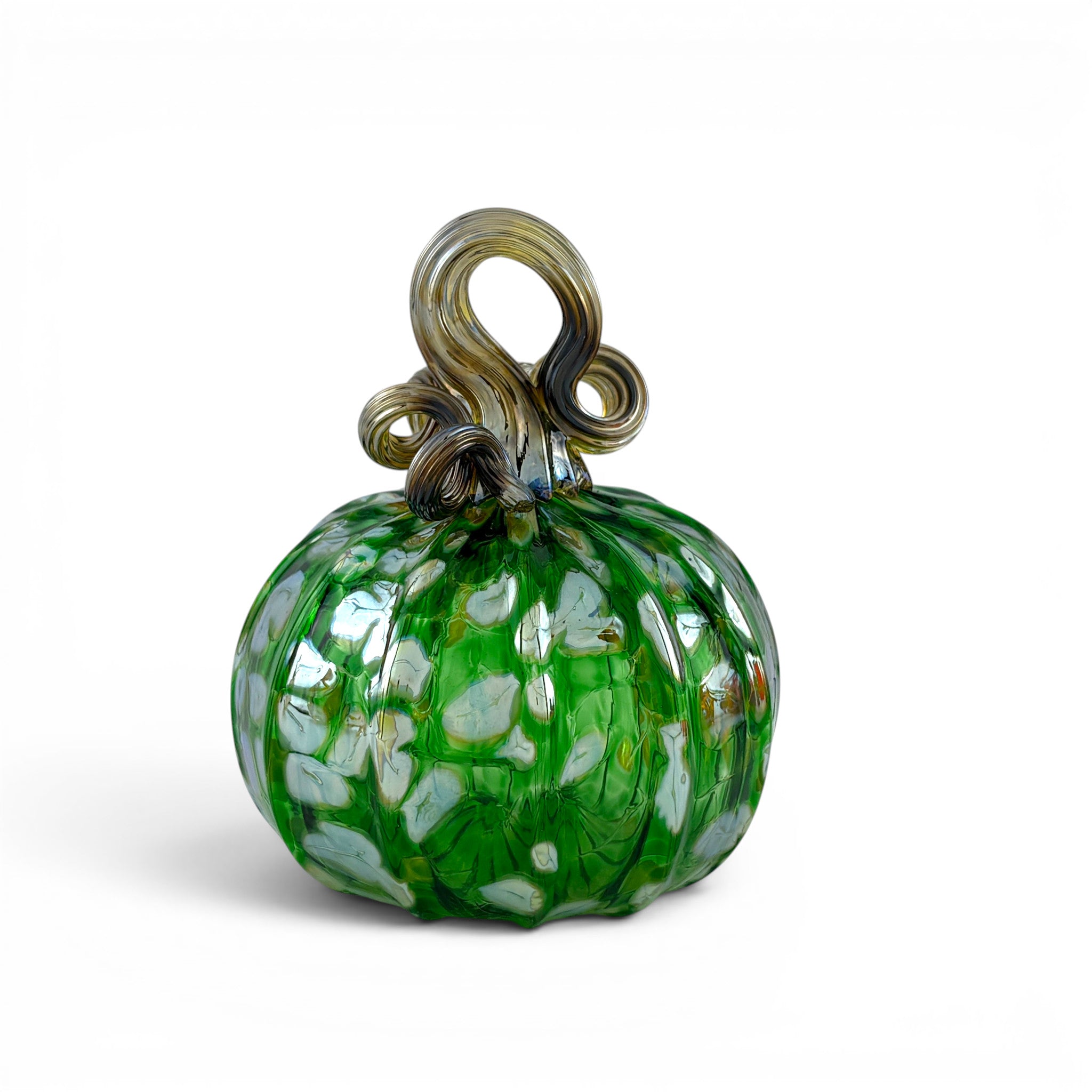 A handcrafted green glass pumpkin with a textured ribbed body, white and light green leaf-like inclusions, and a twisted stem loop. 