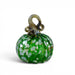 A handcrafted green glass pumpkin with a textured ribbed body, white and light green leaf-like inclusions, and a twisted stem loop. 