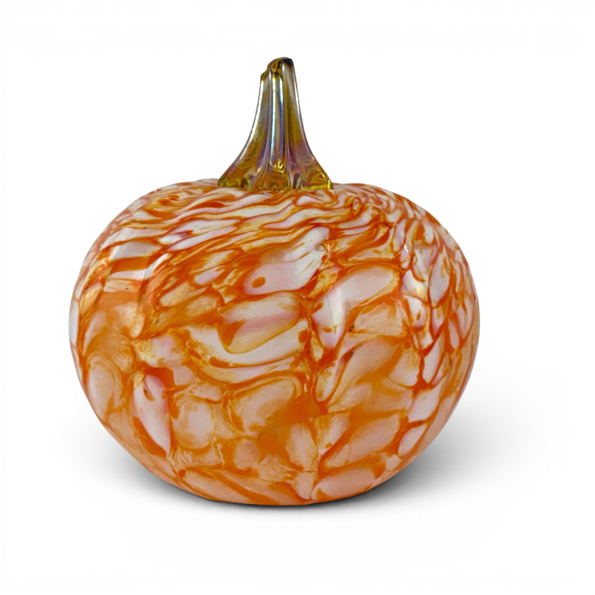 A decorative glass pumpkin with a rounded body featuring marbled orange and white patterns, and a textured amber-brown stem, shown on a clean white background.