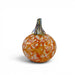 A decorative glass pumpkin with an orange and white marbled pattern and a textured green stem, shown on a clean white background.