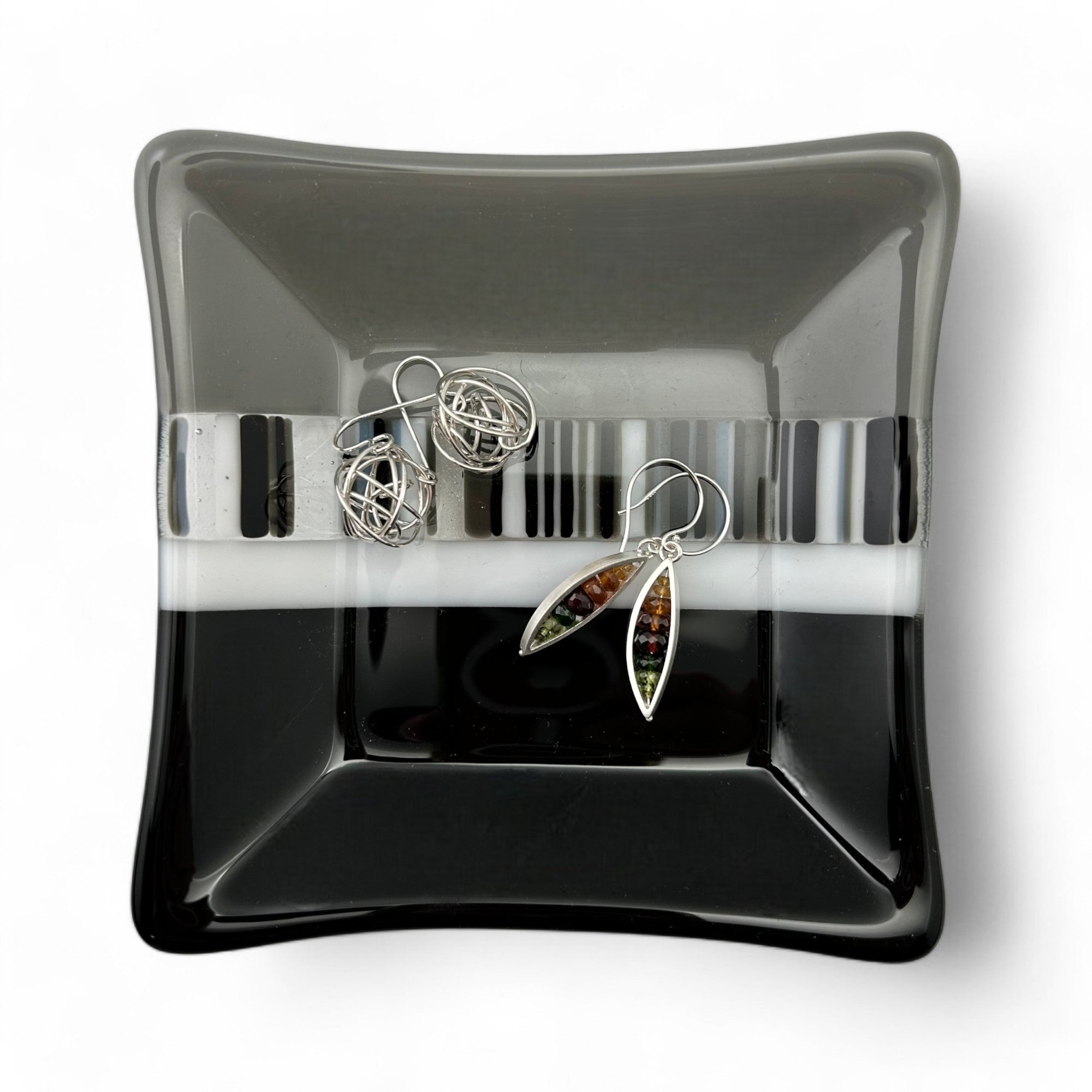 glass dish with gray lines is great for holding jewelry