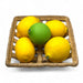 hand-blown glass lemons and lime displayed in a handwoven stoneware ceramic basket.