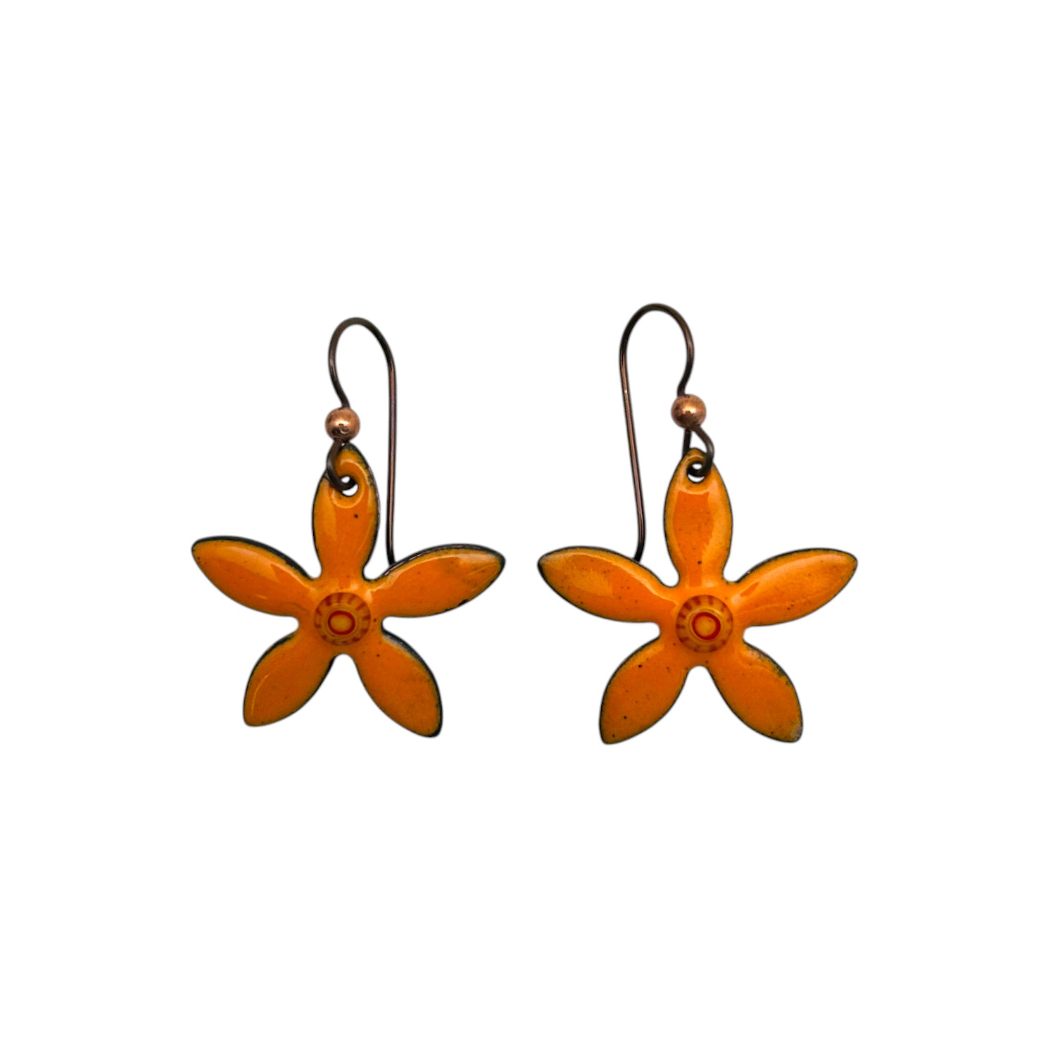 A pair of hand-enameled orange flower-shaped drop earrings with hypoallergenic niobium wire hooks.