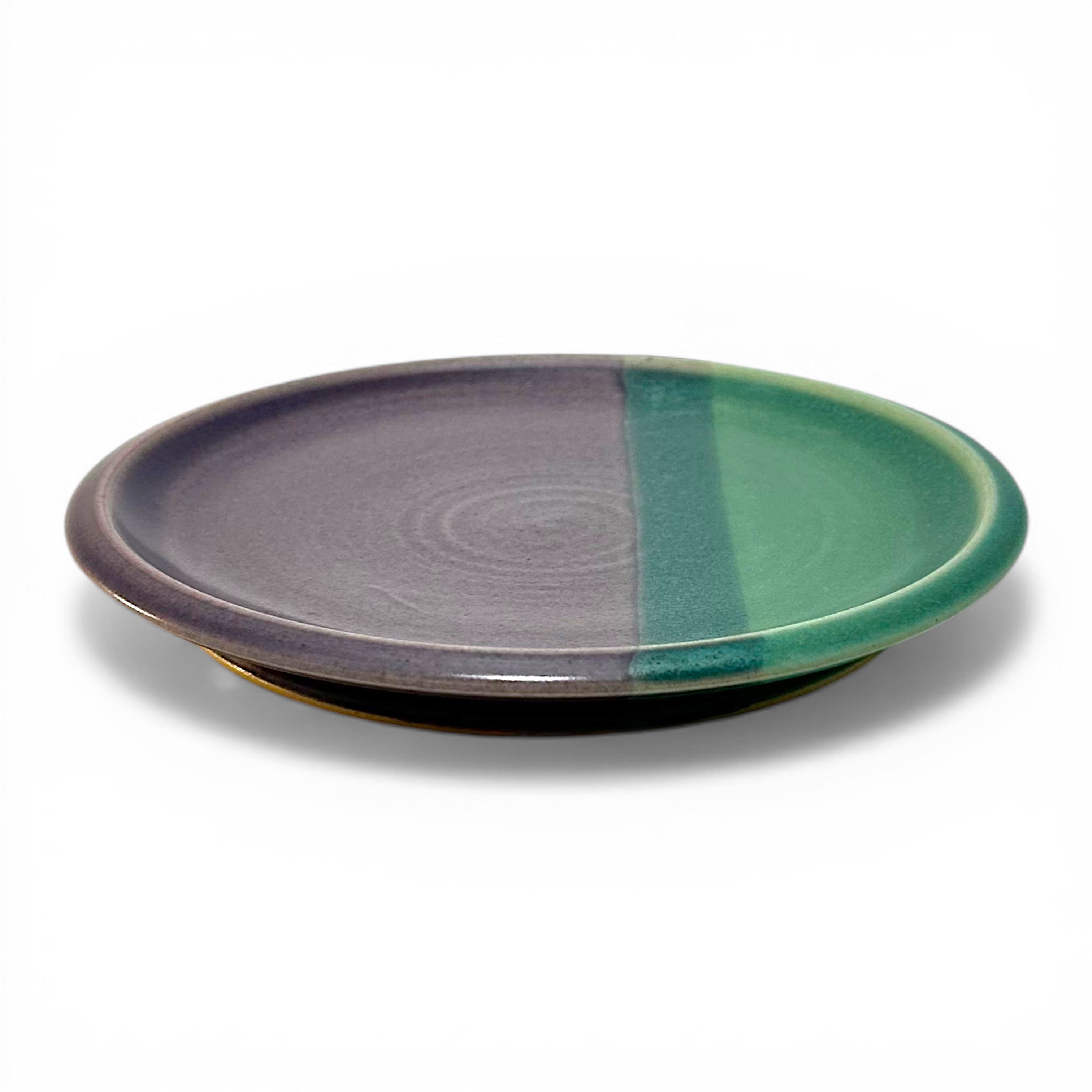 Handcrafted stoneware plate with purple and green design for entertaining or family meals