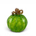 A decorative glass pumpkin with a ribbed green body and a twisted brown stem.
