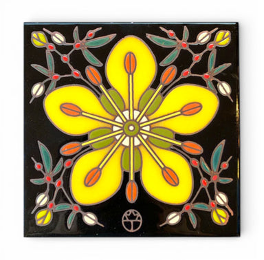 Decorative hand-glazed art  tile with a yellow flower creosote bush design on a black background