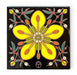 Decorative hand-glazed art  tile with a yellow flower creosote bush design on a black background