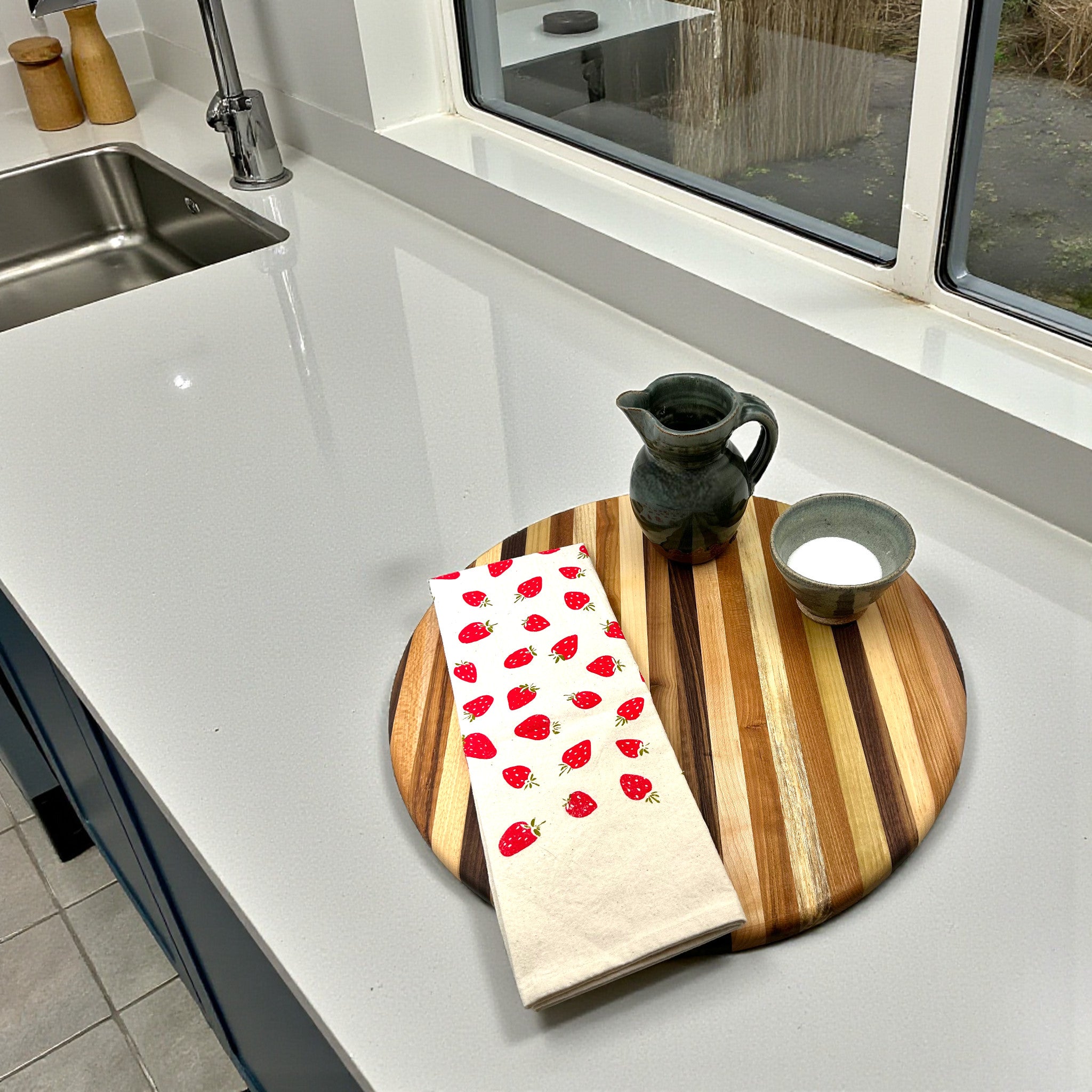 Hand-printed strawberry motif kitchen towel brings a pop of color to kitchen decor
