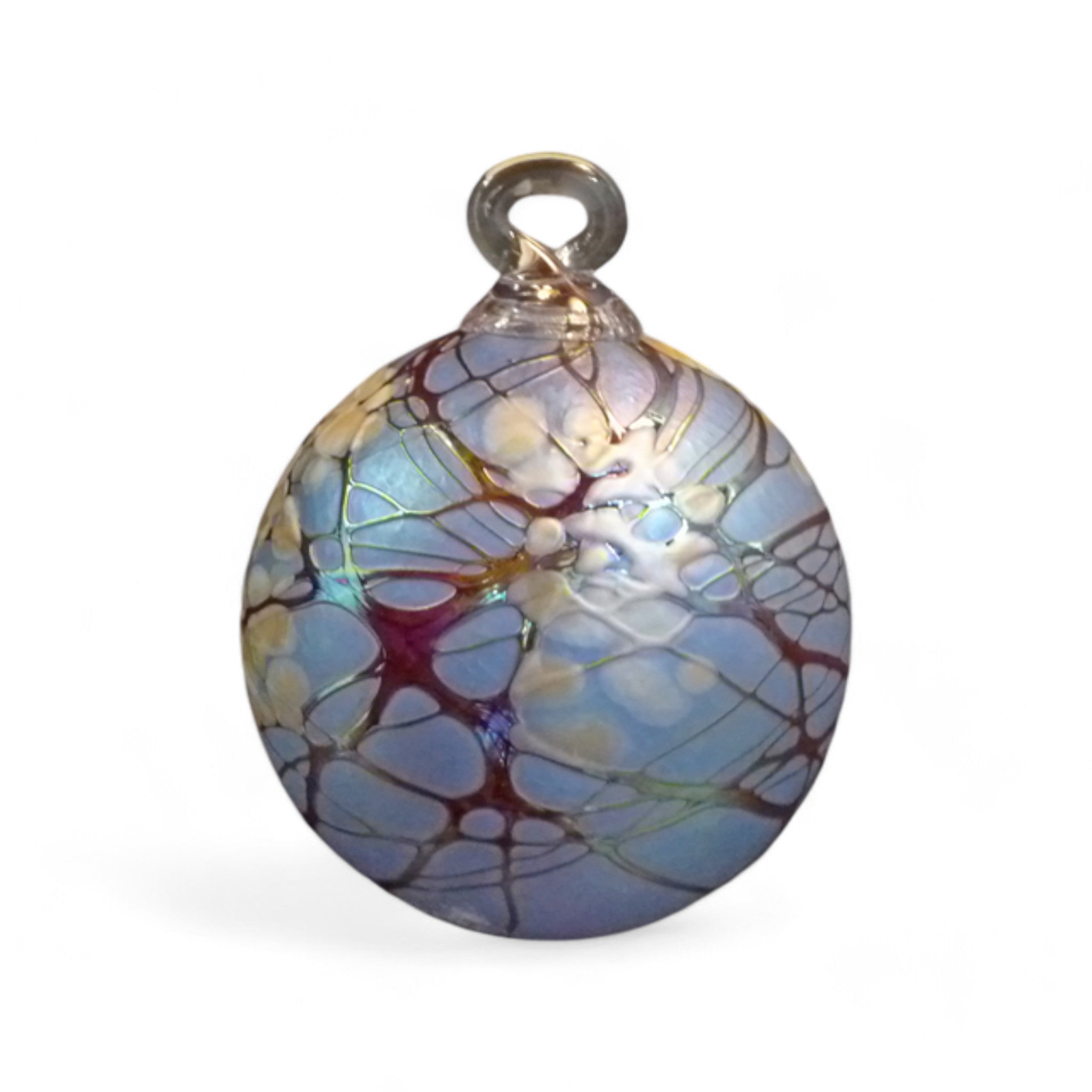 A handcrafted glass ornament with a round shape, featuring a geometric pattern created by colored glass chips. The ornament has a loop on top for hanging.