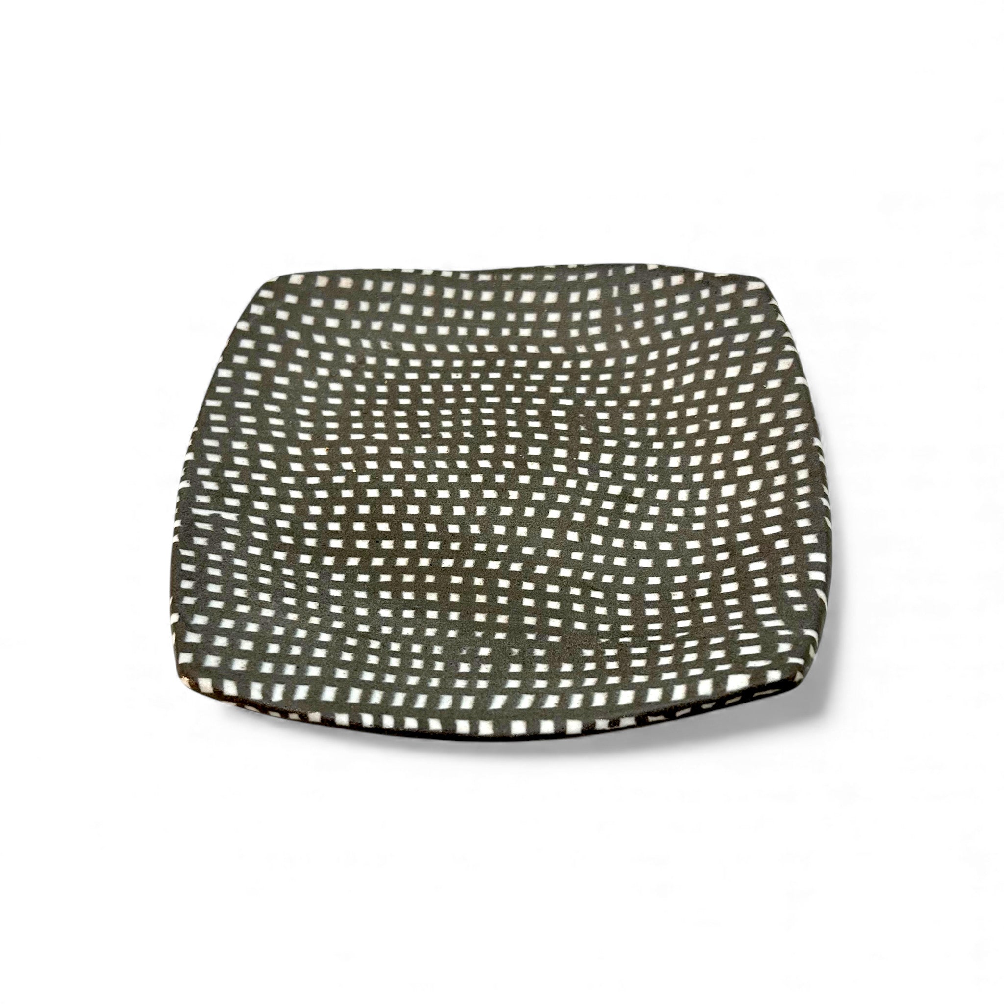 small hand-built colored porcelain plate for small bites