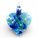 Glass heart ornament with blue and green swirls reminiscent of blue dahlia flowers. 
