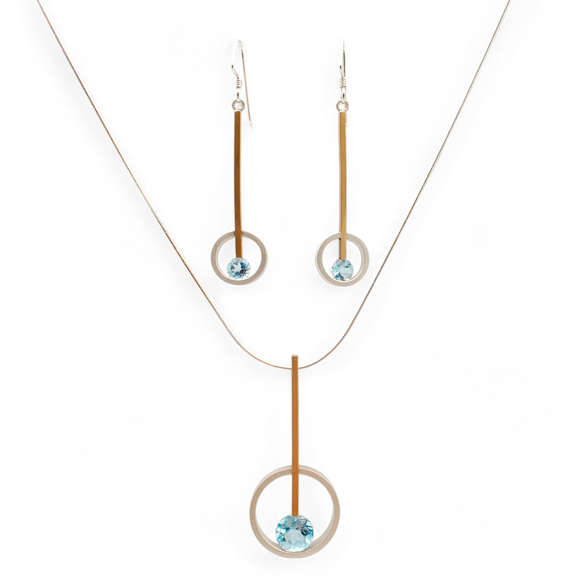 handcrafted set of blue topaz earrings and necklace