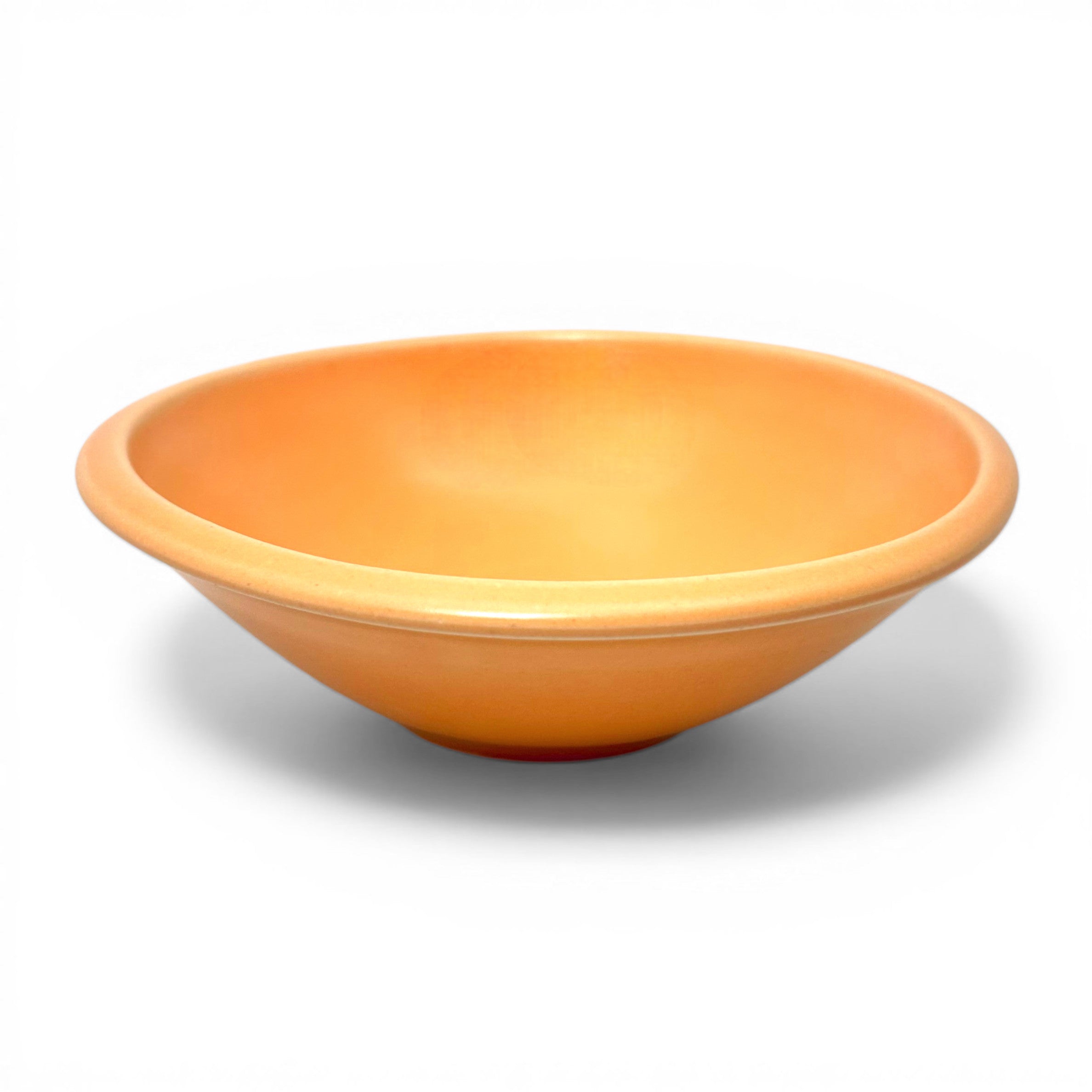 This handcrafted ceramic bowl has a watermelon slice design in the center