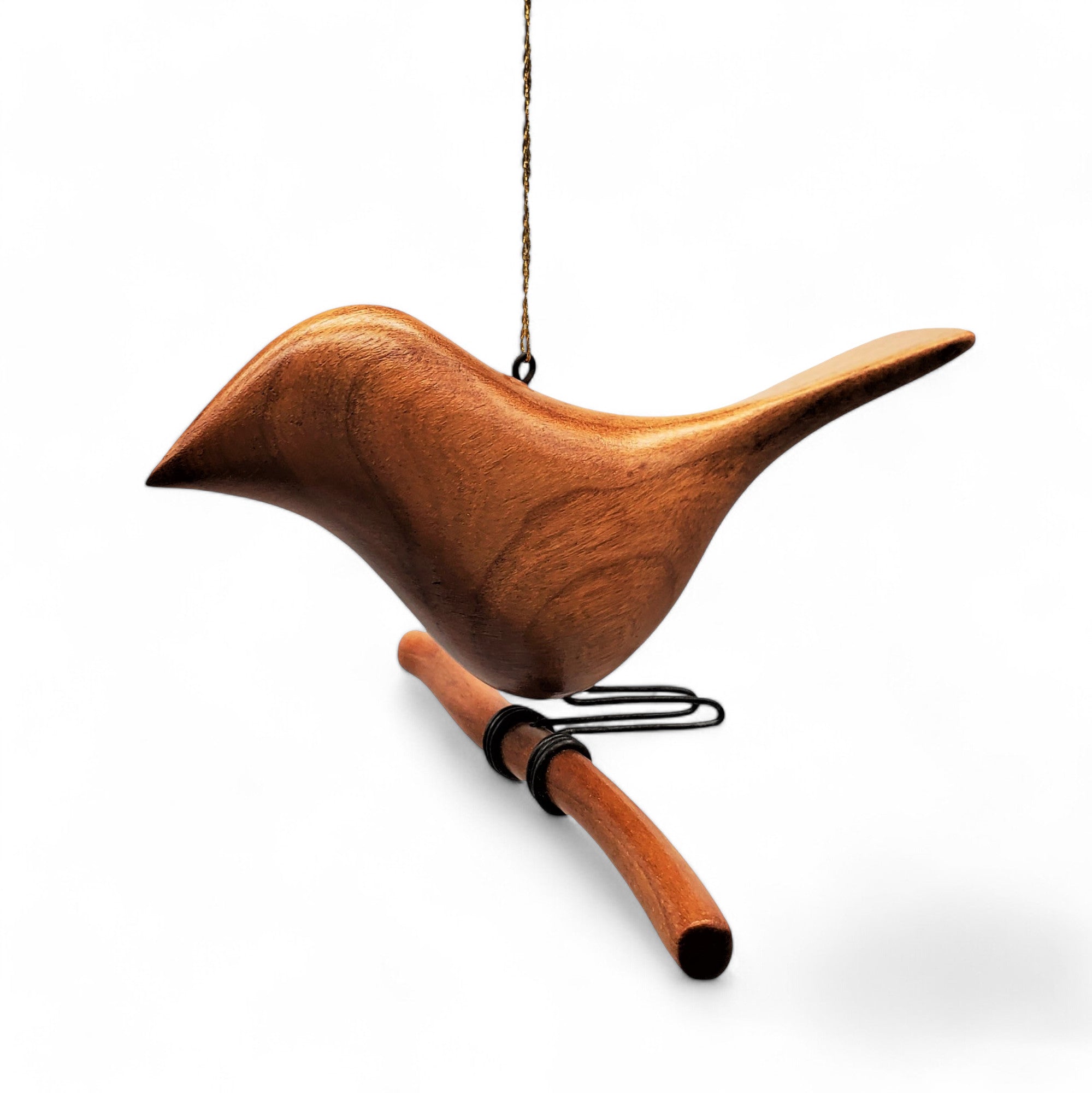 Sized at roughly 4" × 4" × 4", this bird on a branch handcrafted from cherry wood is just the right amount of adorable.
