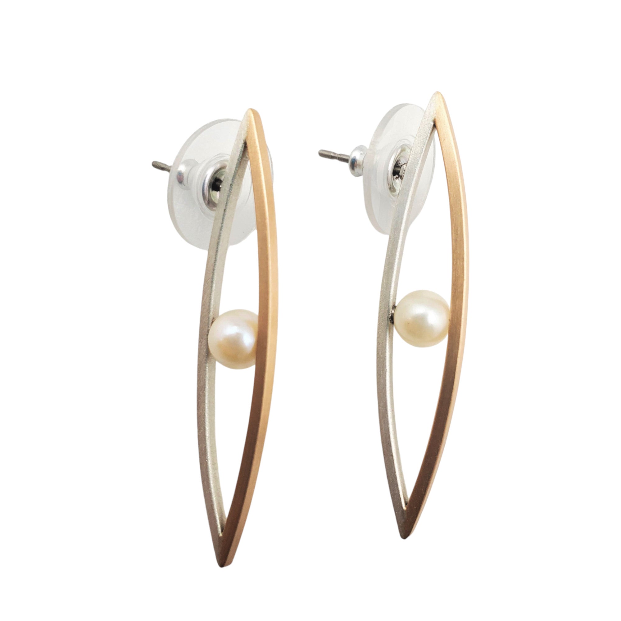 A pair of pearl post earrings with gold fill and brushed sterling silver accents.
