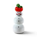 A glossy, handcrafted glass snowman figurine with an orange pumpkin and a green, leafy top, ready to help you usher in the holiday season.   