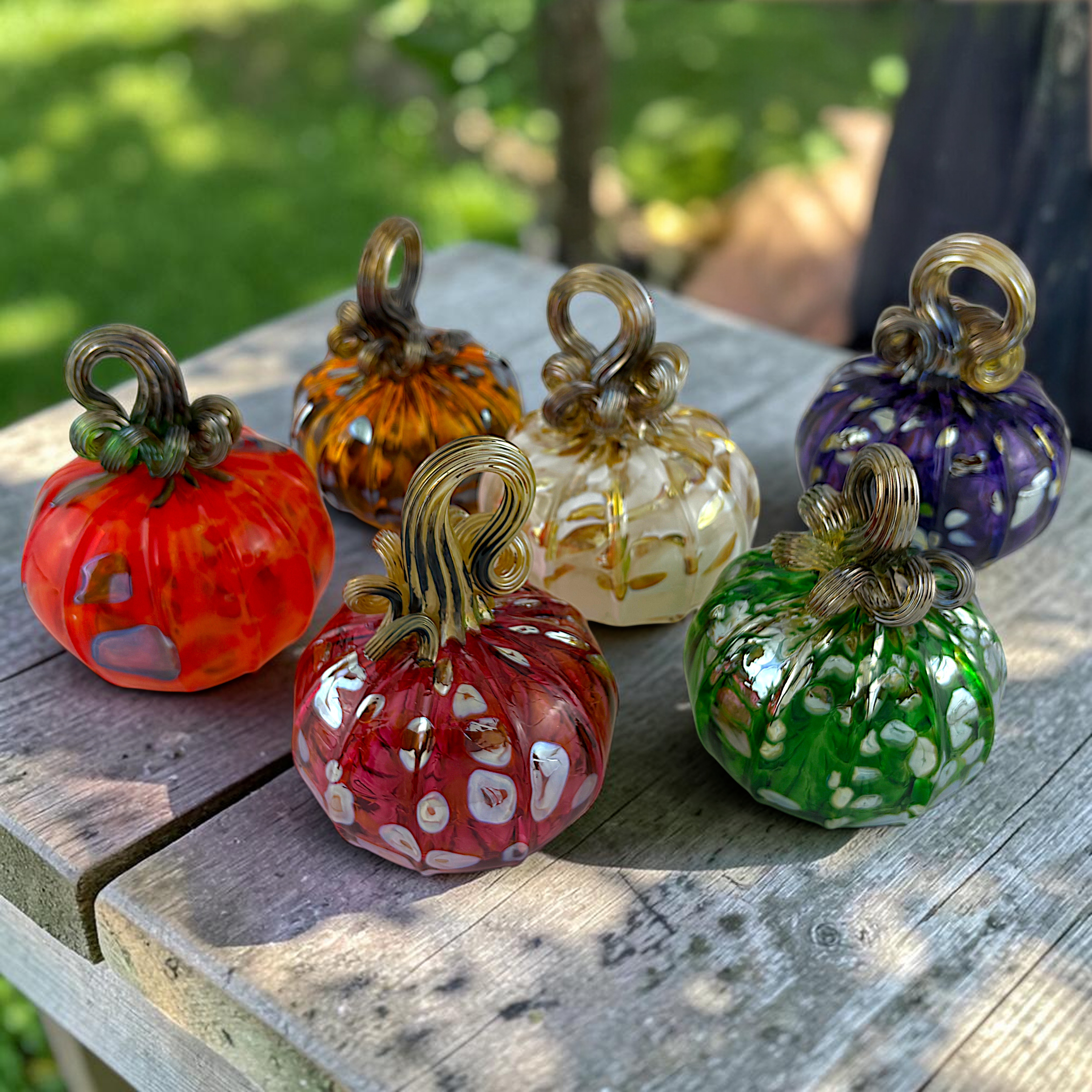 colorful handcrafted glass pumpkins created by Cedar Creek onsite artist Matt Decker 