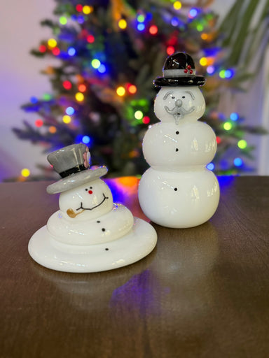 two happy handcrafted glass snowmen decorating for the holidays