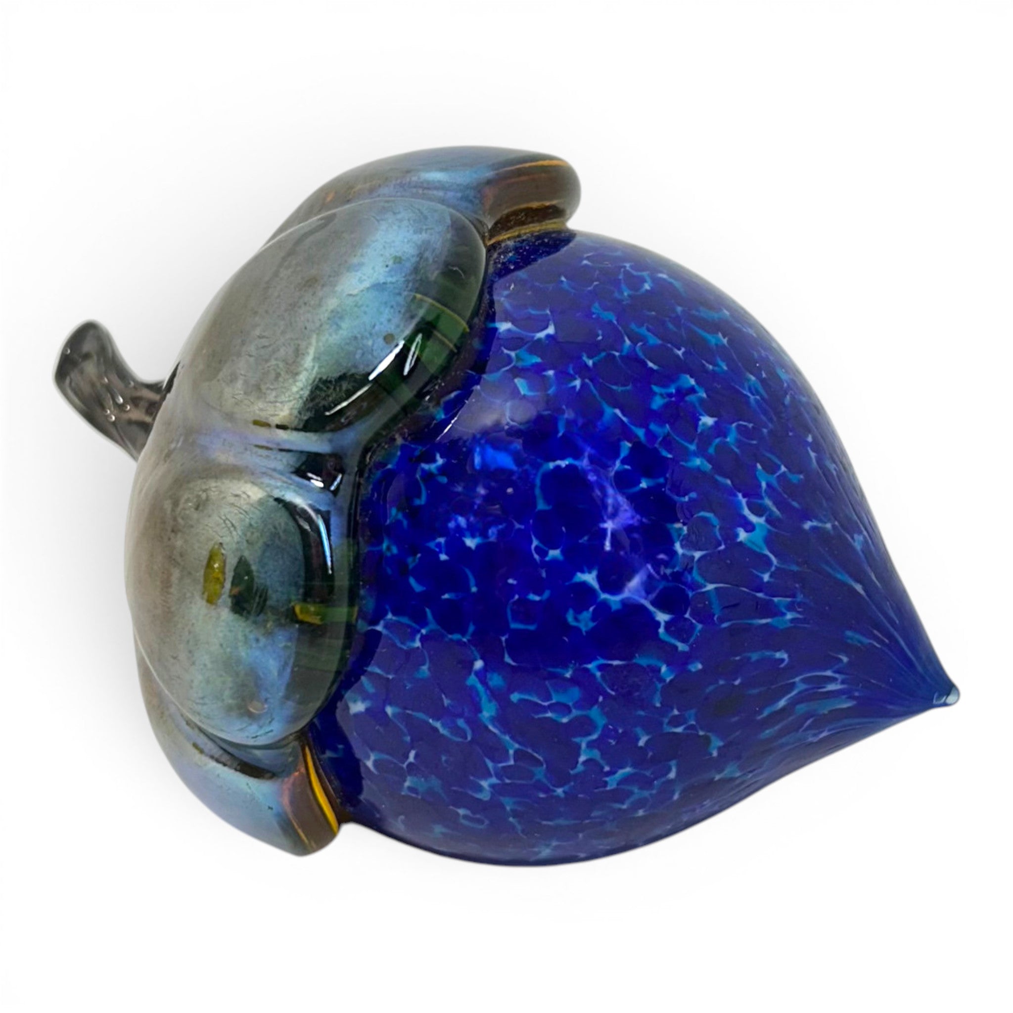 A hand-blown glass acorn sculpture with a deep cobalt blue textured body and a metallic iridescent silver-gray cap.