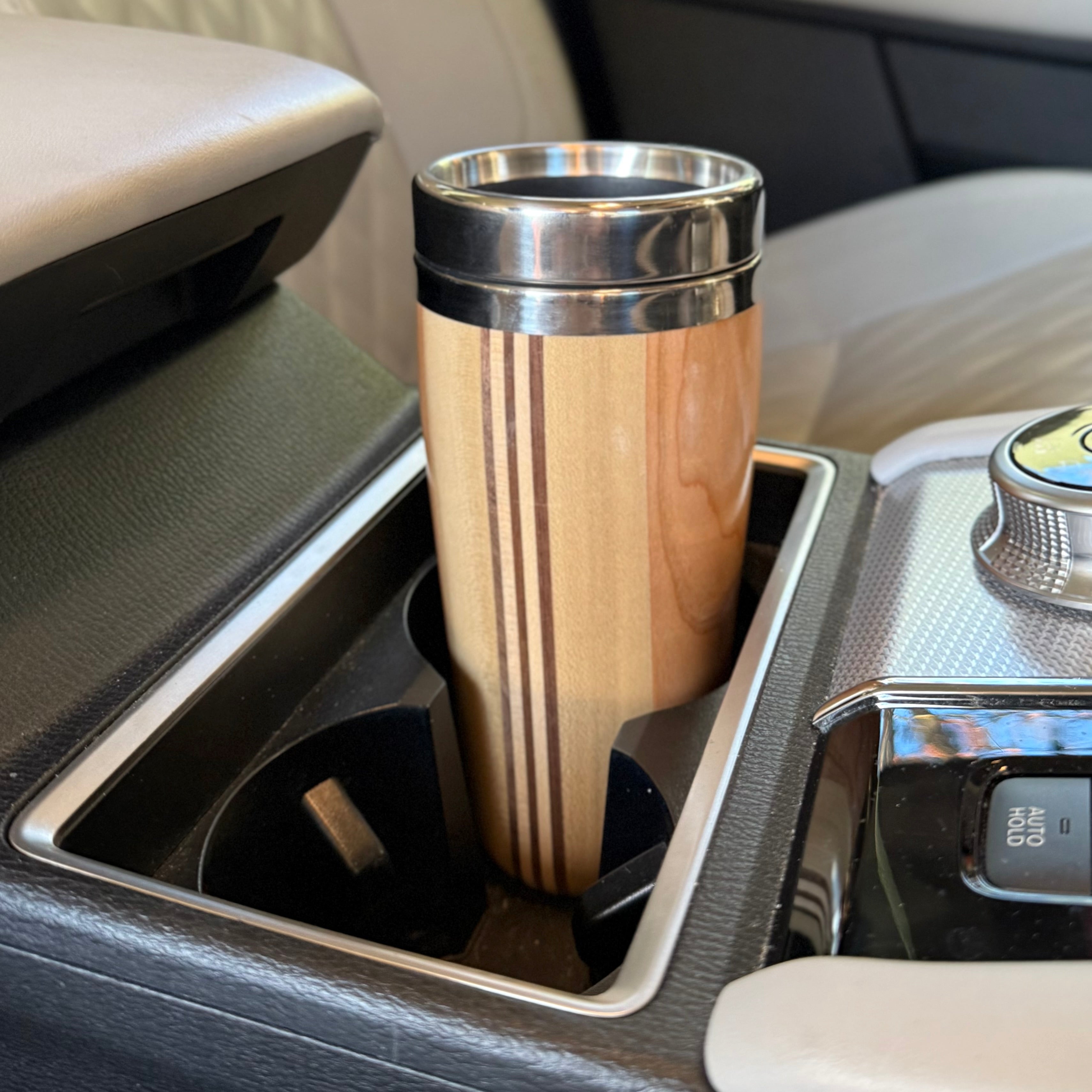 Wooden travel mug in a car cup holder