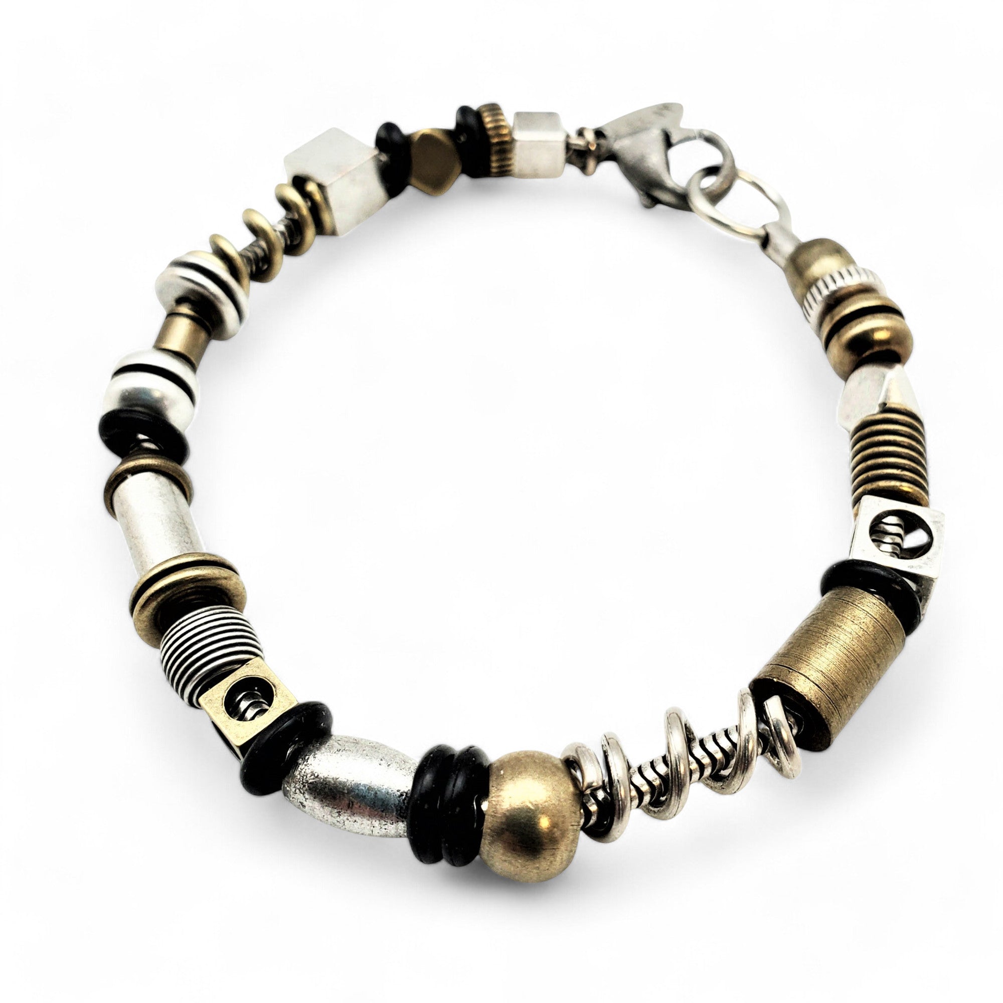 A medium-length mixed multi-bead bracelet with silver and brass-plated hardware, rubber 'O' rings, and a silver-plated snake chain. The bracelet is fastened with a lobster claw clasp.